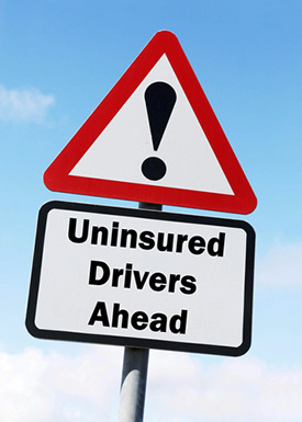Uninsured motorist ahead sign